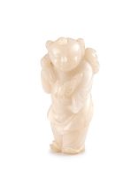 A Chinese white jade figure of a boy, Qing Dynasty, 19th century