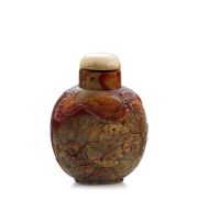 A Chinese celadon and rust jade snuff bottle, Qing Dynasty, 18th/19th century