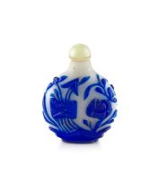 A Chinese overlay milky white and blue glass snuff bottle, late Qing Dynasty