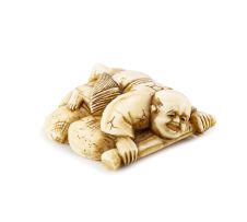 An ivory netsuke of a fisherman with clams, 19th century