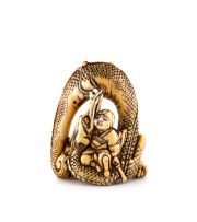 An ivory okimono-netsuke of a dragon, 19th century