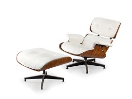 A Charles & Ray Eames white leather and rosewood-veneered 'Model 670' chair and 'Model 671' ottoman, designed 1956, manufactured by Herman Miller