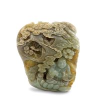 A Chinese celadon jade carved boulder, late Qing Dynasty