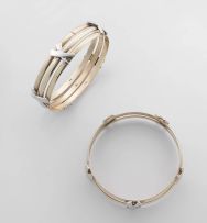 Pair of 9ct yellow and white gold bangles