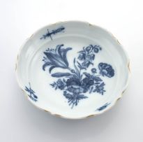 An assembled set of Meissen reticulated blue and white 'Blue Onion' pattern plates and dishes, late 19th/early 20th century