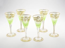 A set of six pale green and gilt flutes, 19th century