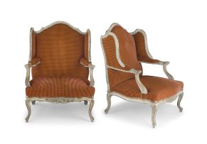 A pair of French painted and upholstered fauteuilles