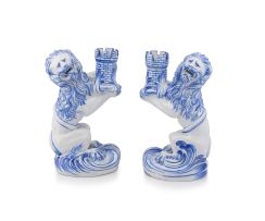 A pair of Emile Gallé Nancy St Clément blue and white faience candle holders, 19th century