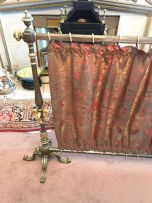 A Victorian steel and gilt fire screen
