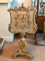 A Victorian giltwood and needlework pole screen