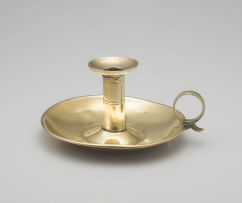 A brass chamberstick, 19th century