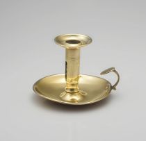 A brass chamberstick, 19th century