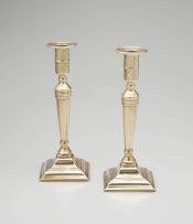 A pair of brass candlesticks, 18th/19th century