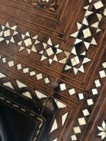 A Middle Eastern ebonised fruitwood, marquetry and bone-inlaid table, 19th century