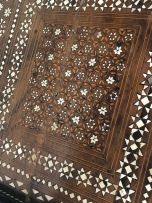 A Middle Eastern ebonised fruitwood, marquetry and bone-inlaid table, 19th century