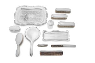 A miscellaneous group of electroplate and silver dressing table wares