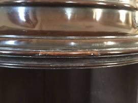 An Edwardian mahogany-veneered cross-banded drum-shaped cabinet