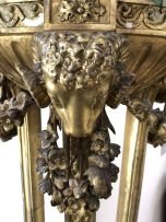 A George III giltwood tripod torchere