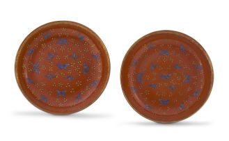A pair of Chinese orange-glazed dishes