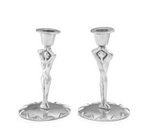 A pair of silvered pewter Carrol Boyes figural candlesticks, modern