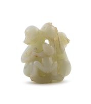 A Chinese pale green jade carving of three monkeys, late 19th century