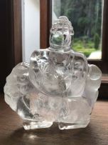 A Chinese carved quartz crystal figure of Buddha, late 19th/early 20th century