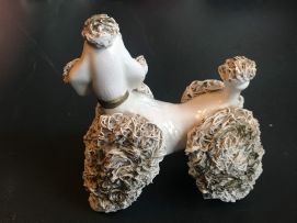 A pair of Dresden figures of poodles, 20th century