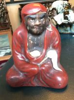 A Japanese stoneware figure of an Immortal, early 20th century