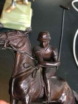 A bronze sculpture of a polo player, 20th century
