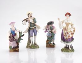 A pair of figurines of gardeners, late 19th century