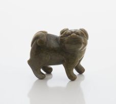 A Chinese olive green jade dog-of-fo, Qing Dynasty, 19th century