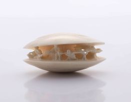 A Japanese ivory okimono carving of the 'clam's dream'