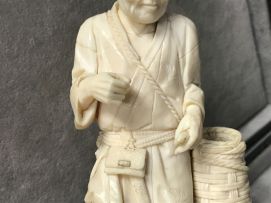 A Japanese ivory okimono of a fisherman, Meiji period, 1868-1912