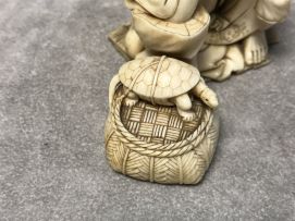 A Japanese ivory okimono of a turtle keeper, Meiji period, 1868-1912