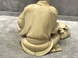 A Japanese ivory okimono of a turtle keeper, Meiji period, 1868-1912