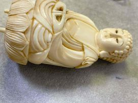 A Japanese ivory okimono of Buddha, Meiji period, 1868-1912