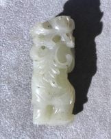 A Chinese celadon jade figure of a boy, Qing Dynasty, 19th century