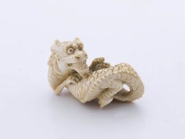 A Japanese ivory netsuke of a dragon, early 20th century