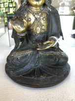 A Chinese parcel-gilt bronze figure of Guanyin, Ming Dynasty, 1636-1644