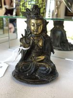 A Chinese parcel-gilt bronze figure of Guanyin, Ming Dynasty, 1636-1644