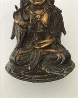 A Chinese parcel-gilt bronze figure of Guanyin, Ming Dynasty, 1636-1644
