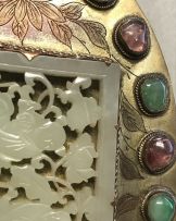 A Chinese carved reticulated pale green jade plaque, Qing Dynasty, 19th century