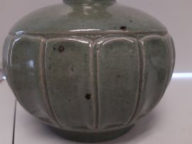 A Chinese celadon crackleware glazed kendi, Qing Dynasty, 17th/18th century