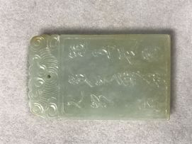 A Chinese celadon jade pendant, Qing Dynasty, 19th century