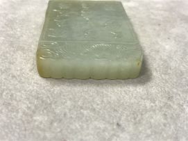 A Chinese celadon jade pendant, Qing Dynasty, 19th century