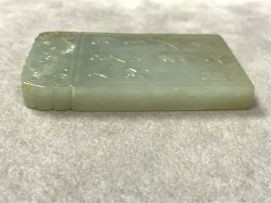 A Chinese celadon jade pendant, Qing Dynasty, 19th century