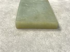 A Chinese celadon jade pendant, Qing Dynasty, 19th century