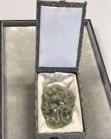 A Chinese celadon 'double chilong' jade plaque, Qing Dynasty, 18th/19th century