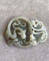 A Chinese celadon 'double chilong' jade plaque, Qing Dynasty, 18th/19th century