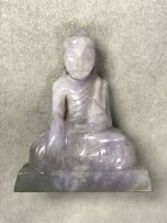 A Chinese lavender jade carved figure of Buddha, Qing Dynasty, 19th/20th century